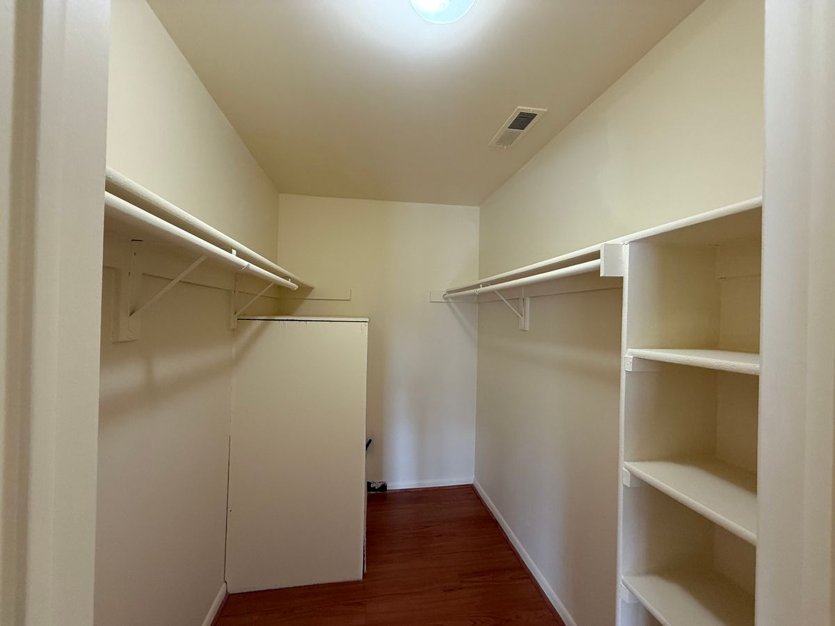 Spacious walk-in closet with built-in shelving